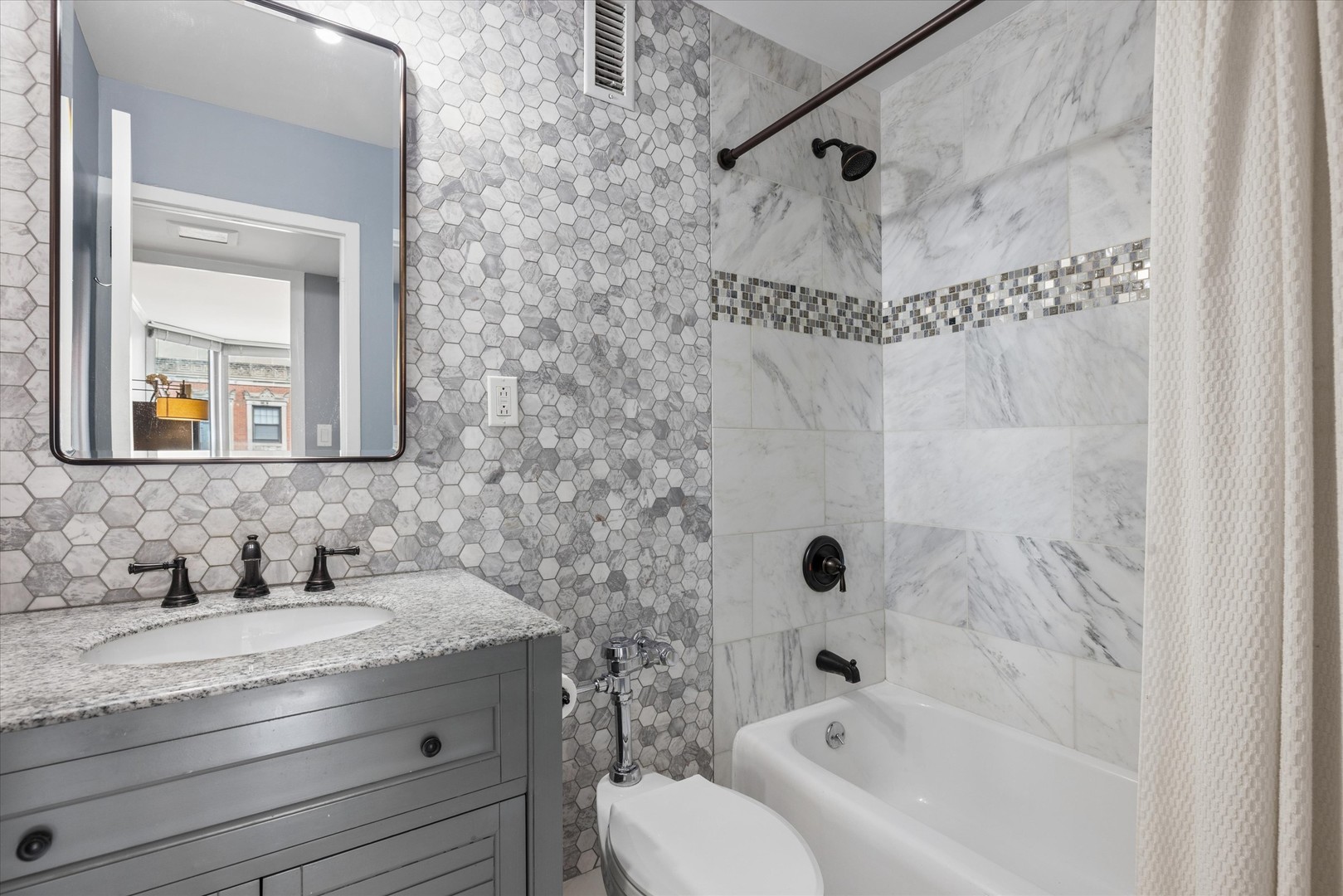 21 West Goethe Street, Unit 15A Chicago, IL 60610 - Photo 14 of 20 a bathroom with a granite countertop sink a toilet and shower