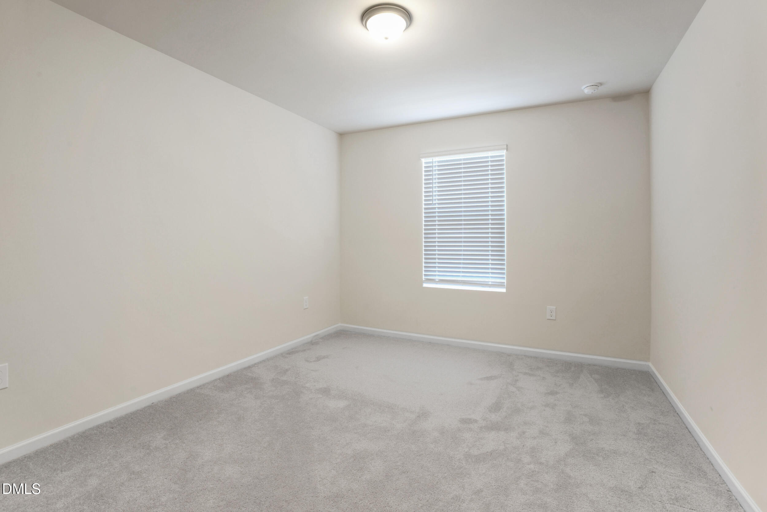 1416 Heron Pond Street Raleigh, NC 27604 - Photo 21 of 25 an empty room with a window