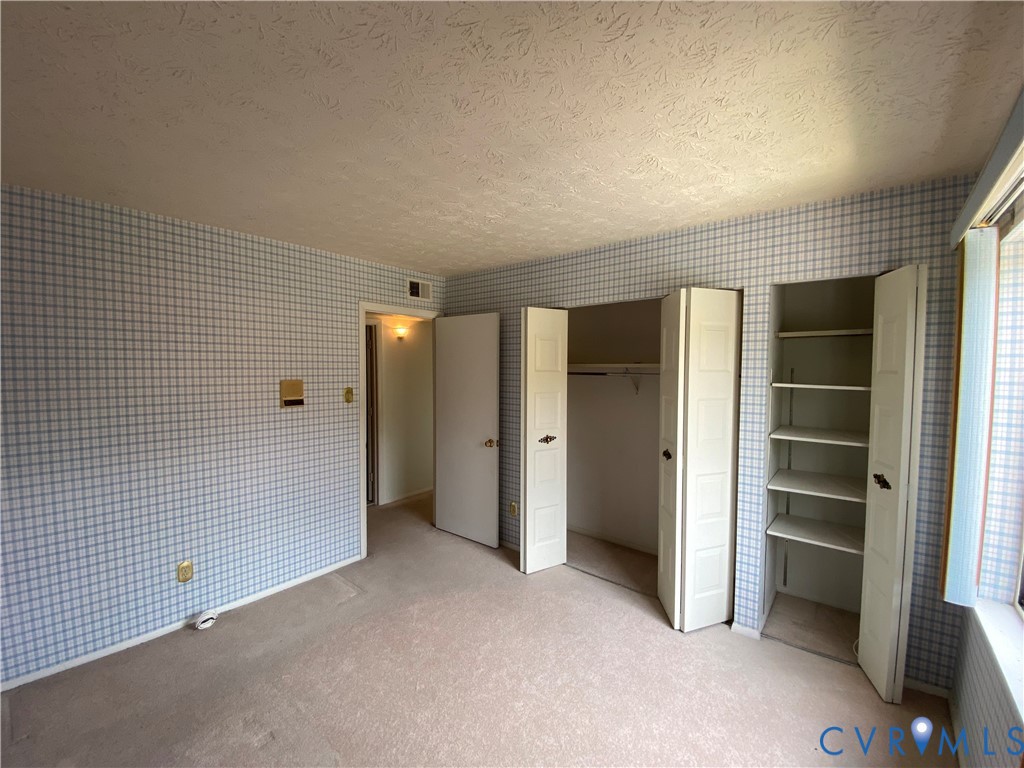 1507 Bronwyn Road, Unit 301 Henrico, VA 23238 - Photo 32 of 41 a view of an empty room with a closet