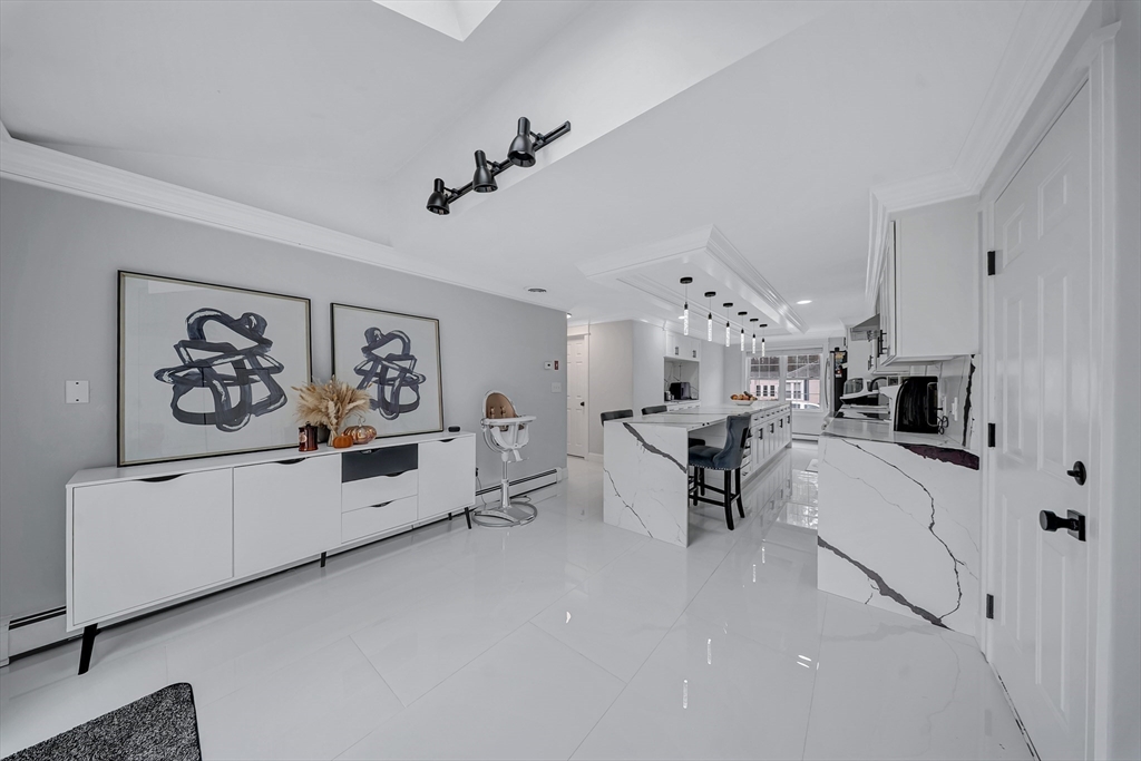 3 Stoddard Street Upton, MA 01568 - Photo 11 of 42 a living room with furniture and kitchen view