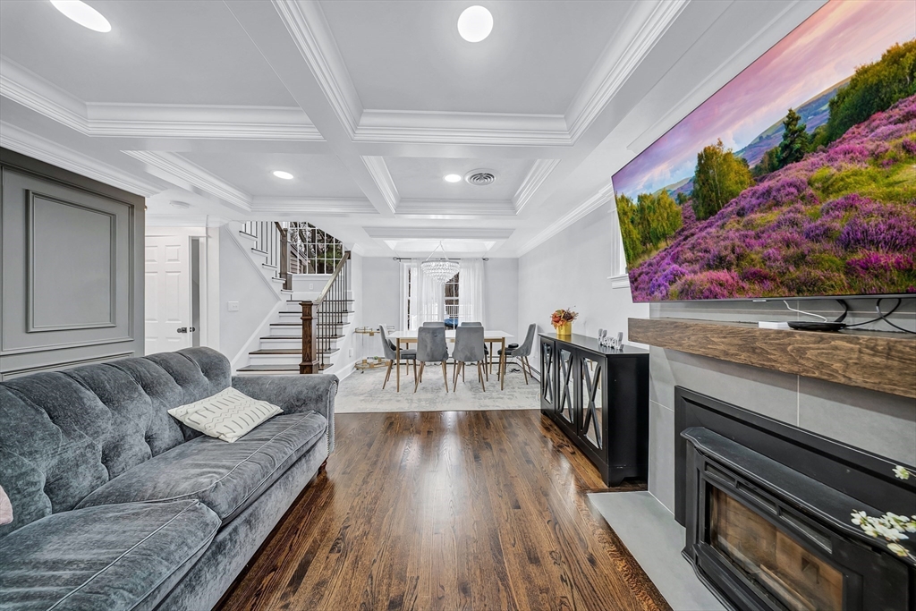 3 Stoddard Street Upton, MA 01568 - Photo 13 of 42 a living room with furniture and flowers