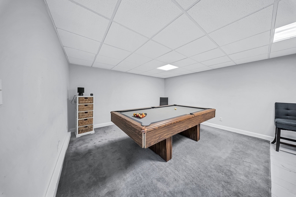 3 Stoddard Street Upton, MA 01568 - Photo 28 of 42 a room with pool table and a bookshelf