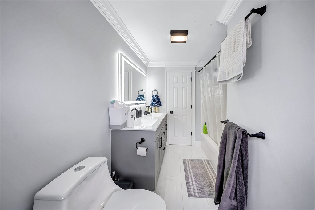 3 Stoddard Street Upton, MA 01568 - Photo 30 of 42 a bathroom with a toilet sink and mirror