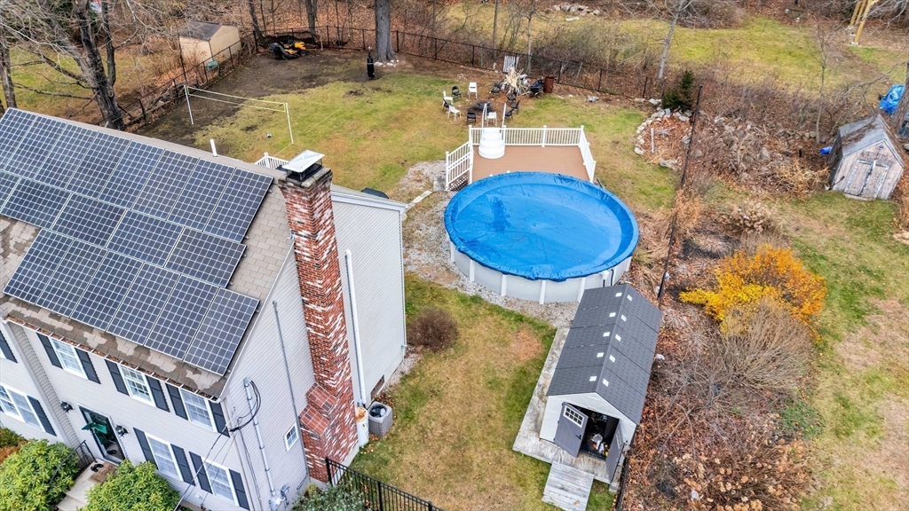 3 Stoddard Street Upton, MA 01568 - Photo 41 of 42 an aerial view of a house with swimming pool and large trees