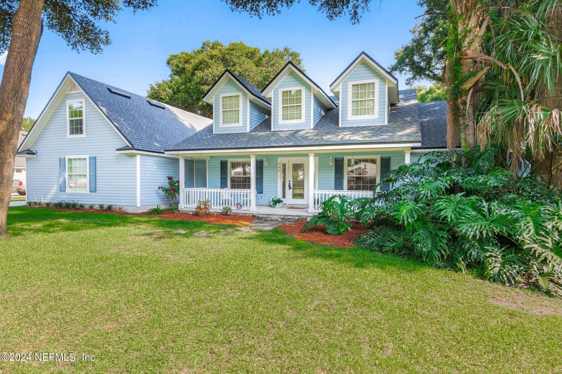 205 Shirley's Way St. Augustine, FL 32086 - Photo 1 of 57 a front view of a house with a yard and porch