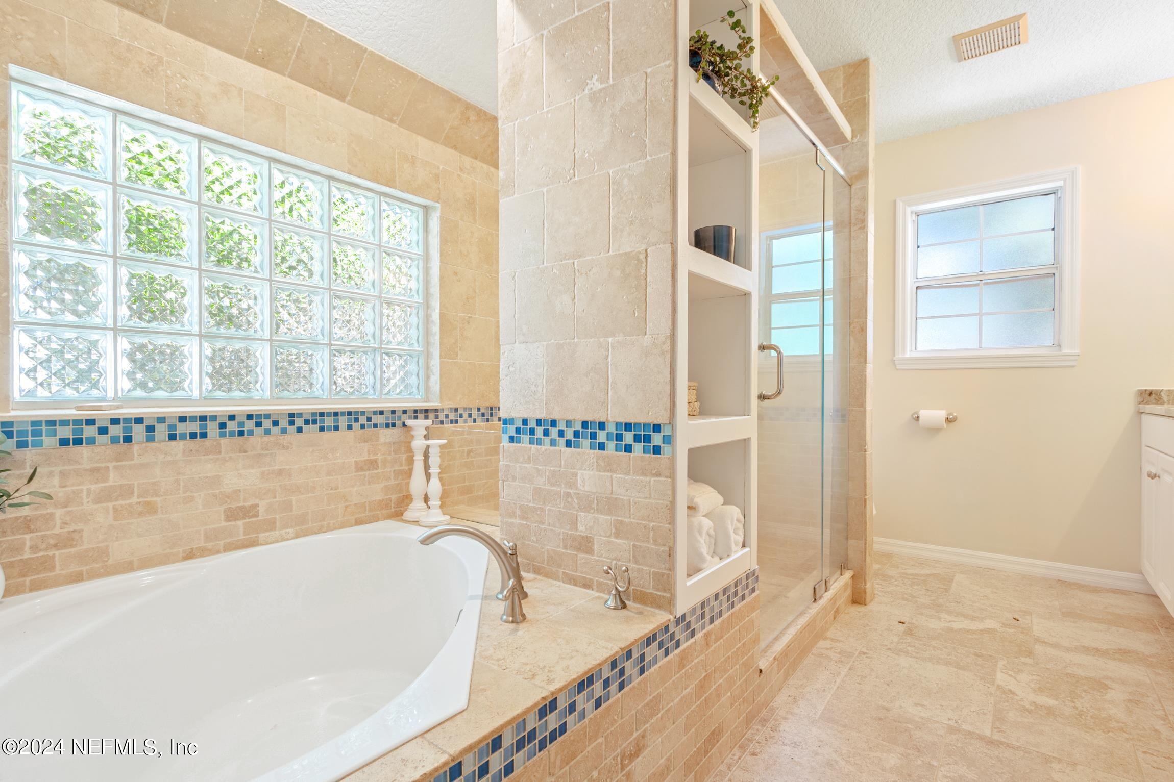 205 Shirley's Way St. Augustine, FL 32086 - Photo 18 of 57 a bathroom with a bathtub and a shower