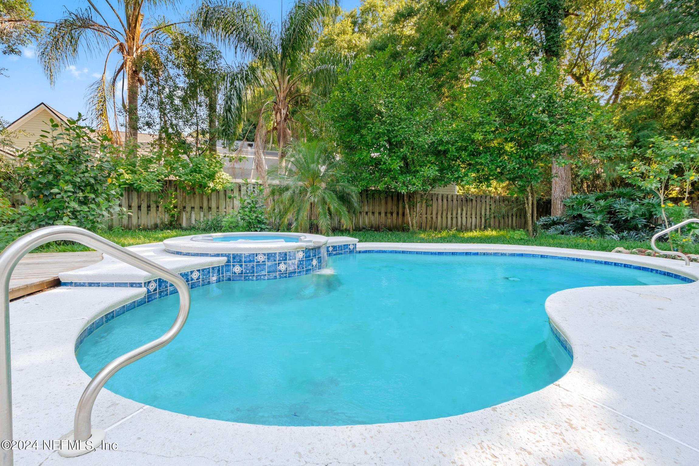 205 Shirley's Way St. Augustine, FL 32086 - Photo 33 of 57 a view of a swimming pool with a backyard