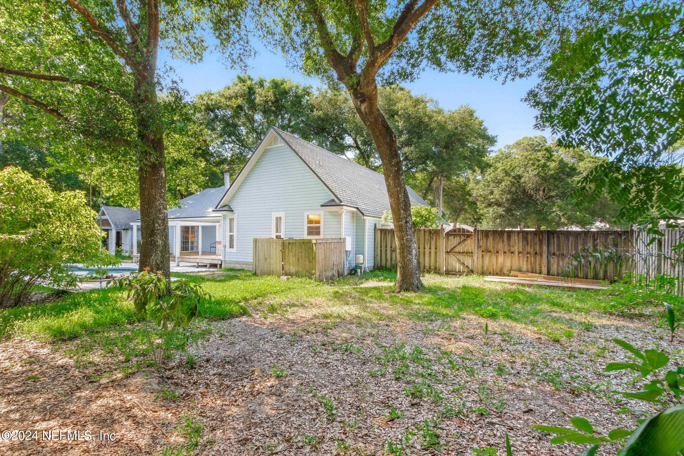 205 Shirley's Way St. Augustine, FL 32086 - Photo 36 of 57 a view of a house with yard and a garden
