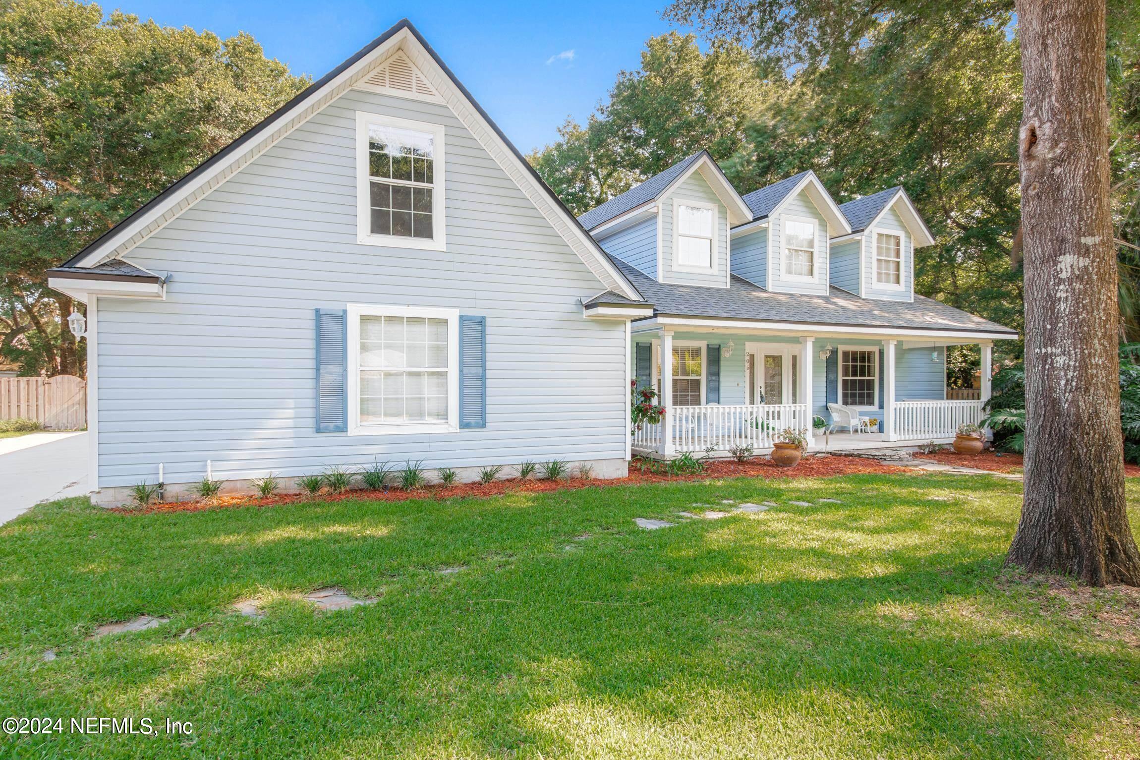 205 Shirley's Way St. Augustine, FL 32086 - Photo 41 of 57 a view of a house with a yard and porch