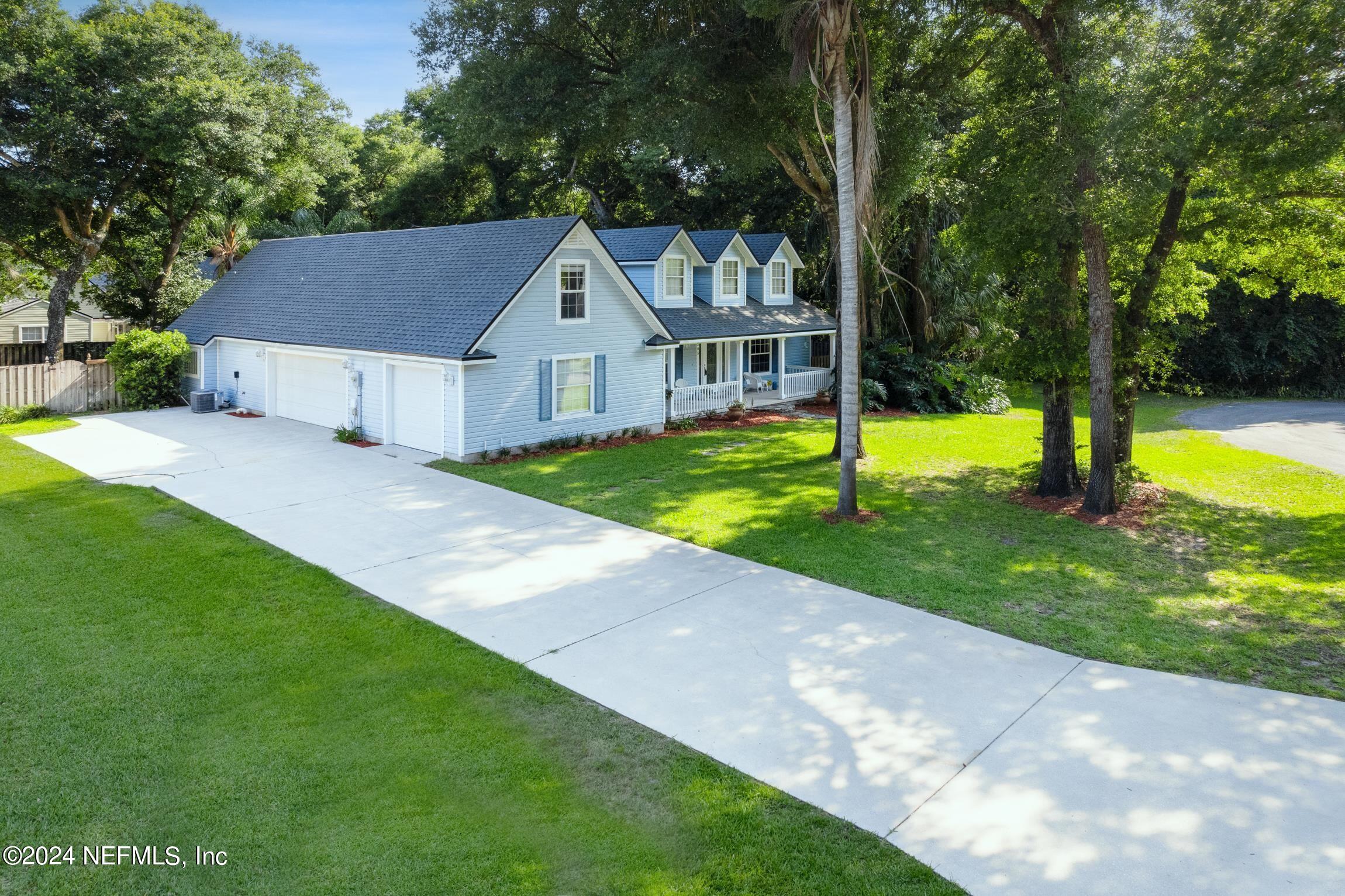 205 Shirley's Way St. Augustine, FL 32086 - Photo 46 of 57 a front view of a house with a yard