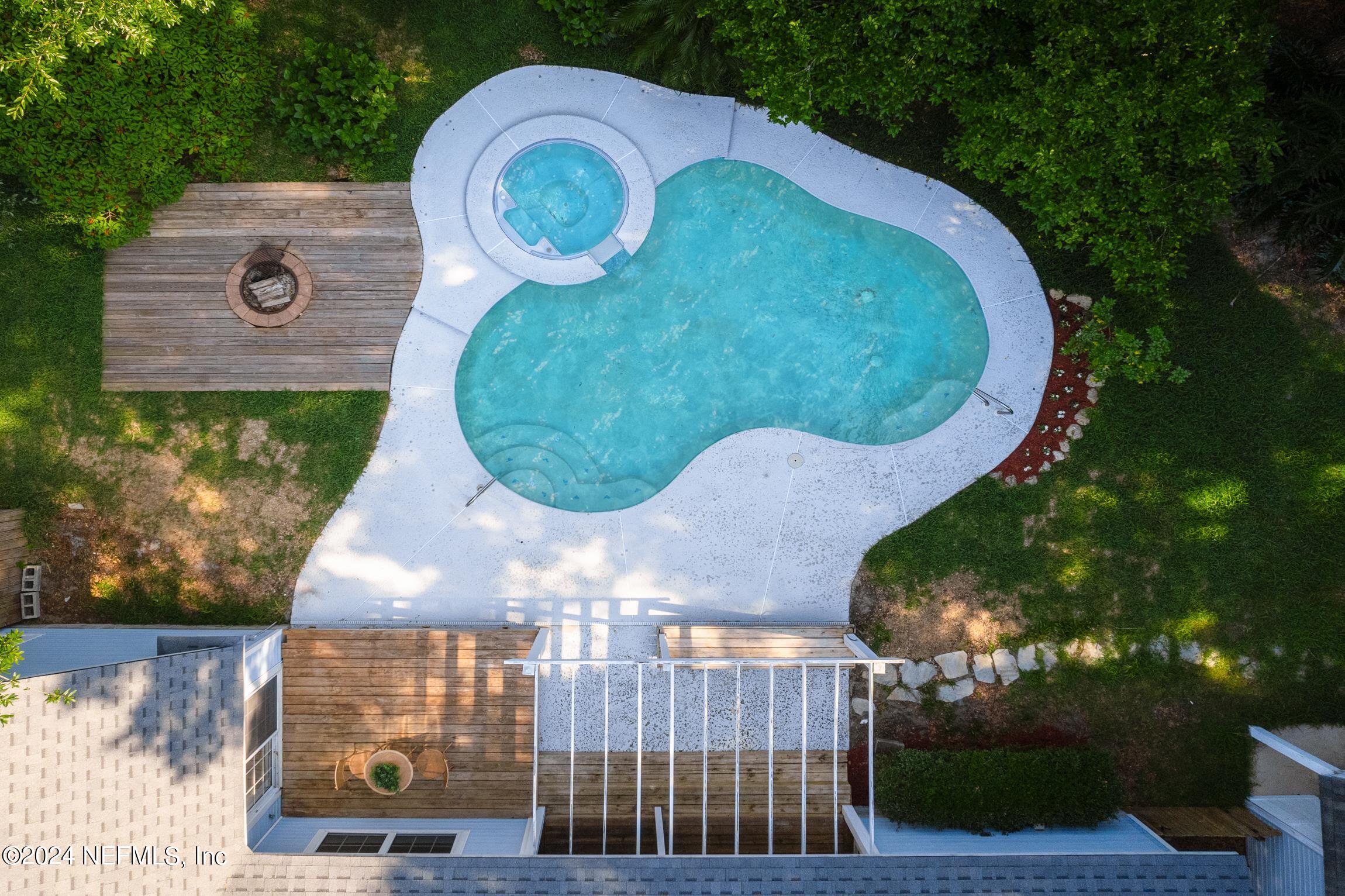 205 Shirley's Way St. Augustine, FL 32086 - Photo 55 of 57 an aerial view of a house with garden space and outdoor seating