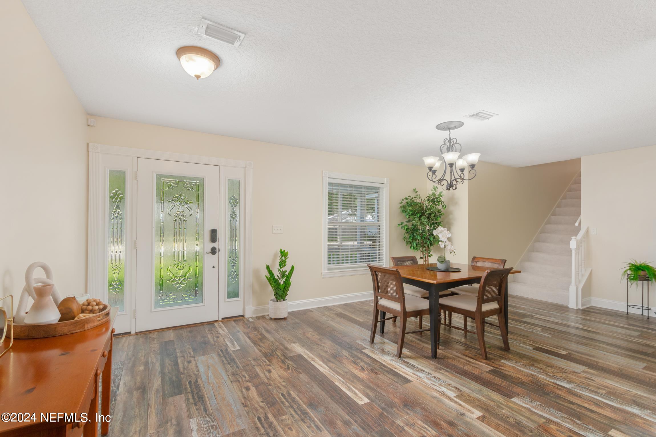 205 Shirley's Way St. Augustine, FL 32086 - Photo 6 of 57 a dining room with furniture a livingroom and chandelier