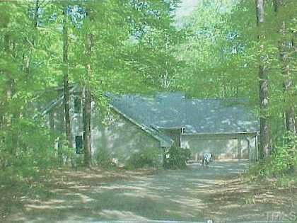 5408 Huntingwood Drive Raleigh, NC 27606 - Photo 1 of 1 a view of a trees in a yard