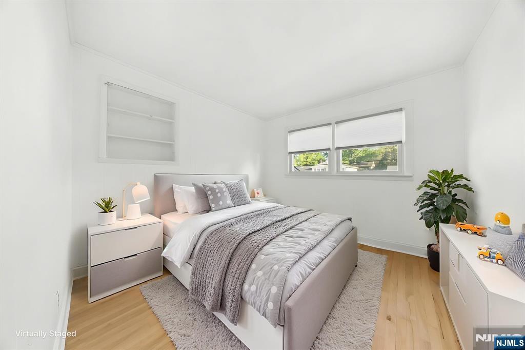 62 Sycamore Road Dumont, NJ 07628 - Photo 19 of 43 a bedroom with a bed and a window