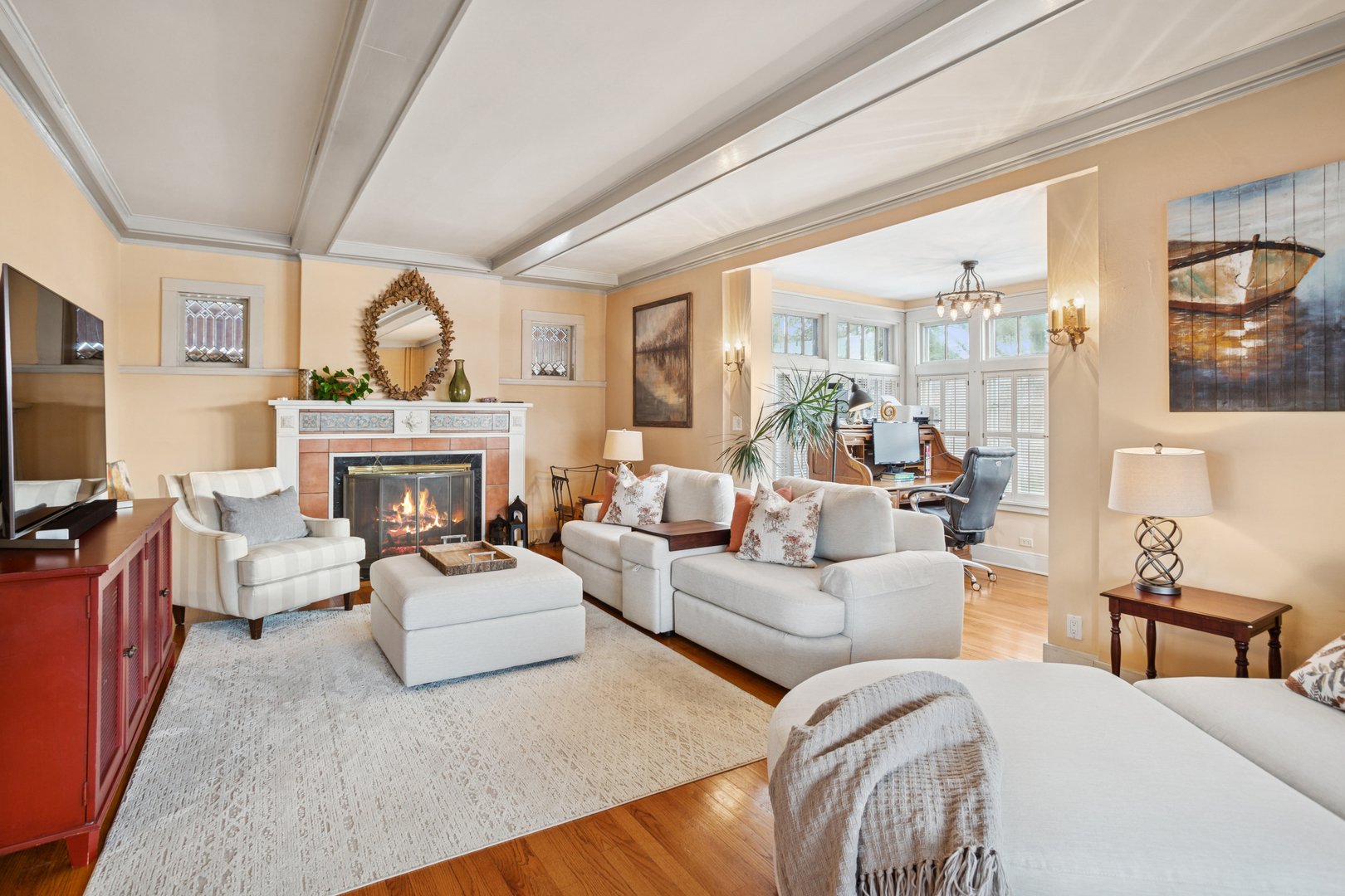 305 North Addison Avenue Elmhurst, IL 60126 - Photo 5 of 29 a living room with furniture a fireplace and a flat screen tv