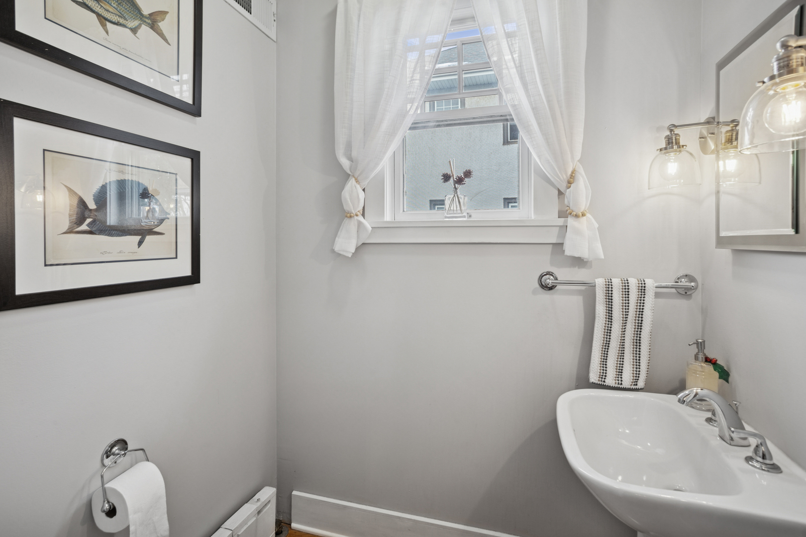 305 North Addison Avenue Elmhurst, IL 60126 - Photo 10 of 29 a bathroom with a sink and a mirror