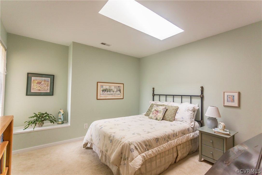 14338 Regatta Pointe Road Midlothian, VA 23112 - Photo 22 of 40 a bedroom with a bed and a night stand