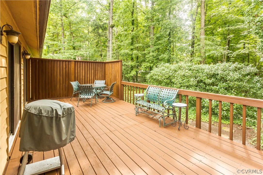 14338 Regatta Pointe Road Midlothian, VA 23112 - Photo 33 of 40 a balcony with wooden floor table and chairs