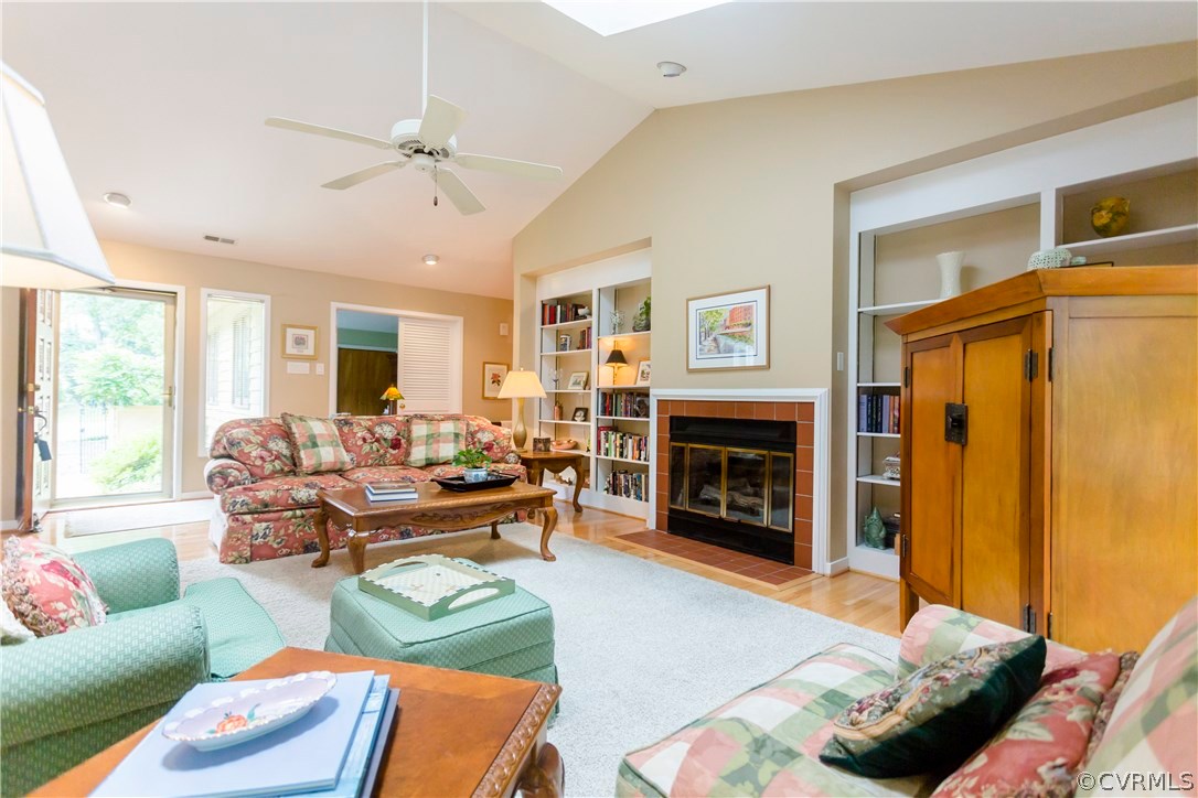 14338 Regatta Pointe Road Midlothian, VA 23112 - Photo 6 of 40 a living room with furniture and a fireplace