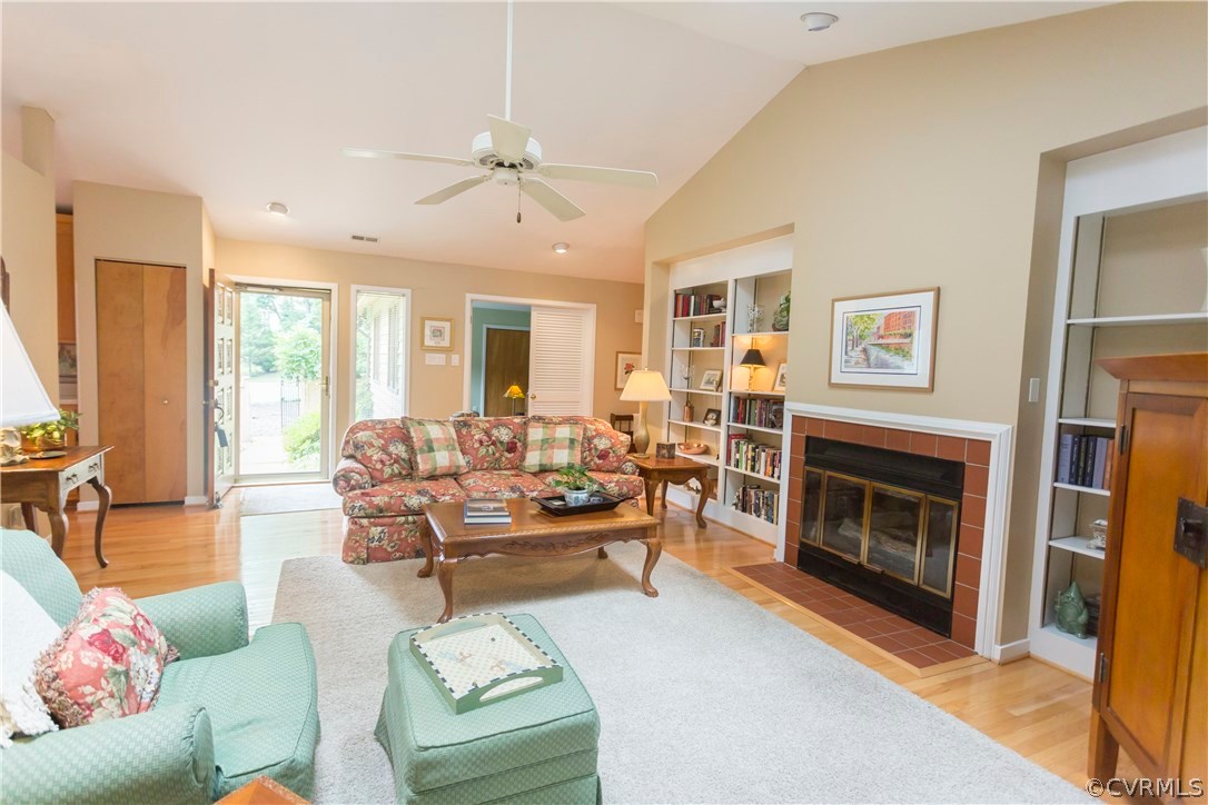 14338 Regatta Pointe Road Midlothian, VA 23112 - Photo 7 of 40 a living room with furniture large window and fireplace