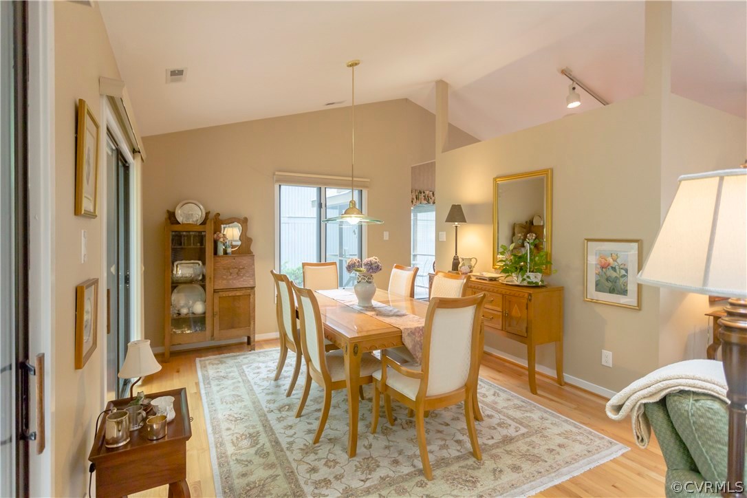 14338 Regatta Pointe Road Midlothian, VA 23112 - Photo 9 of 40 a view of a dining room with furniture and wooden floor