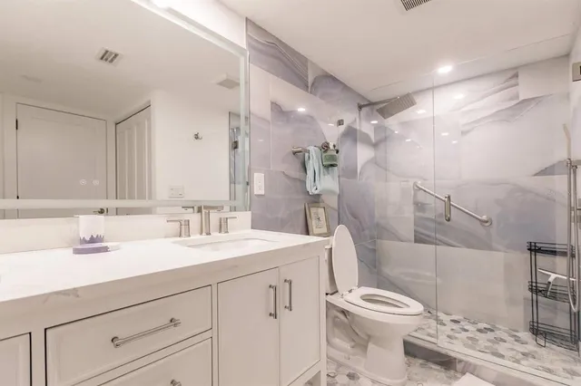 a bedroom with two beds and a large window