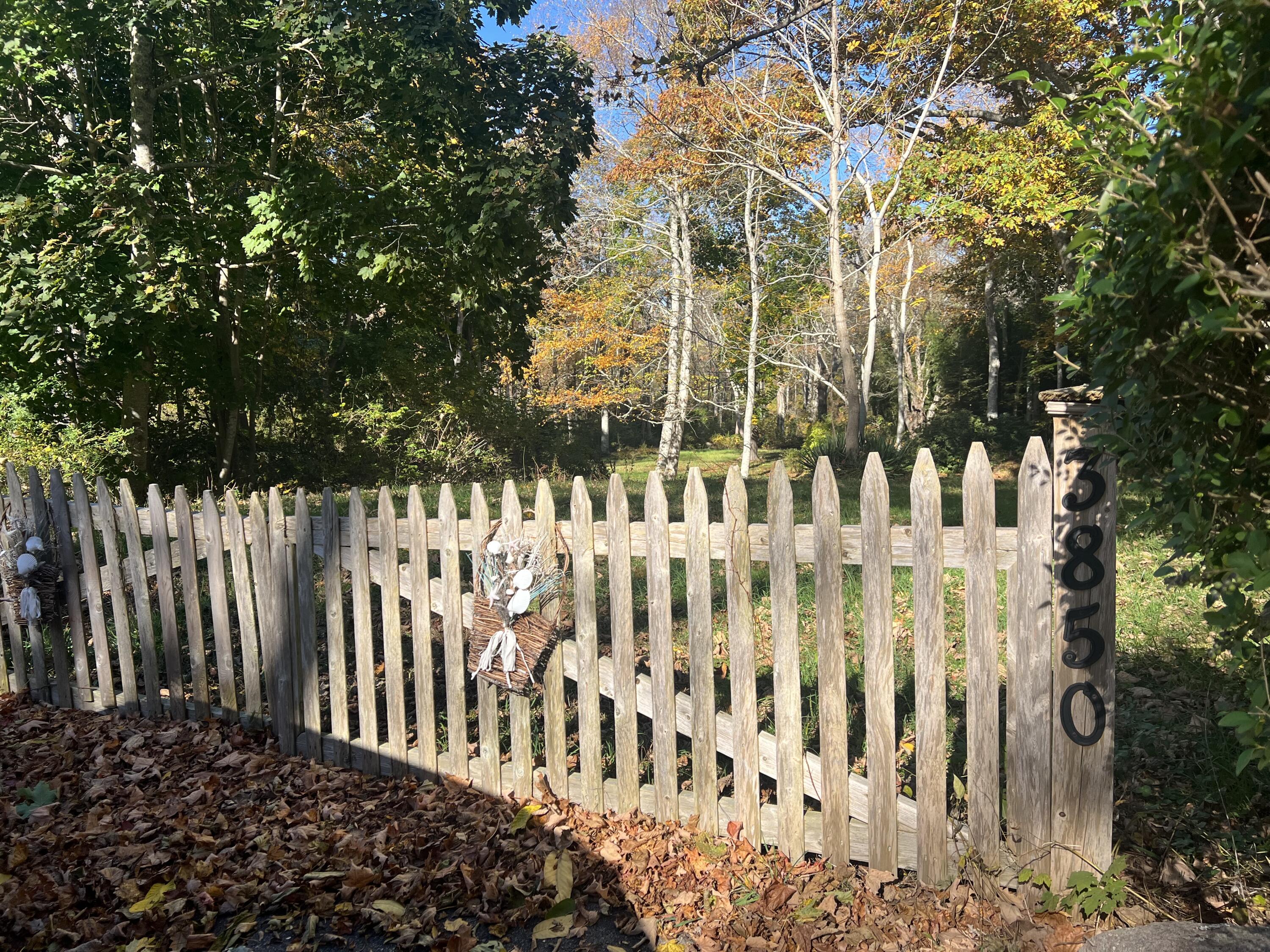 3850 Main Street Barnstable, MA 02630 - Photo 3 of 16 a view of a wooden fence