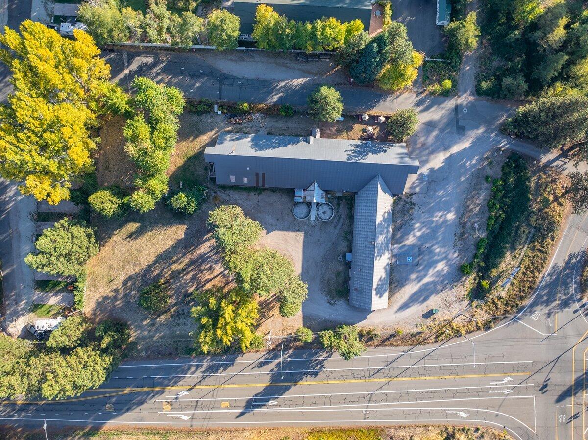 110 Squaw Valley Road McCloud, CA 96057 - Photo 3 of 20 a front view of a house with a yard and a garden