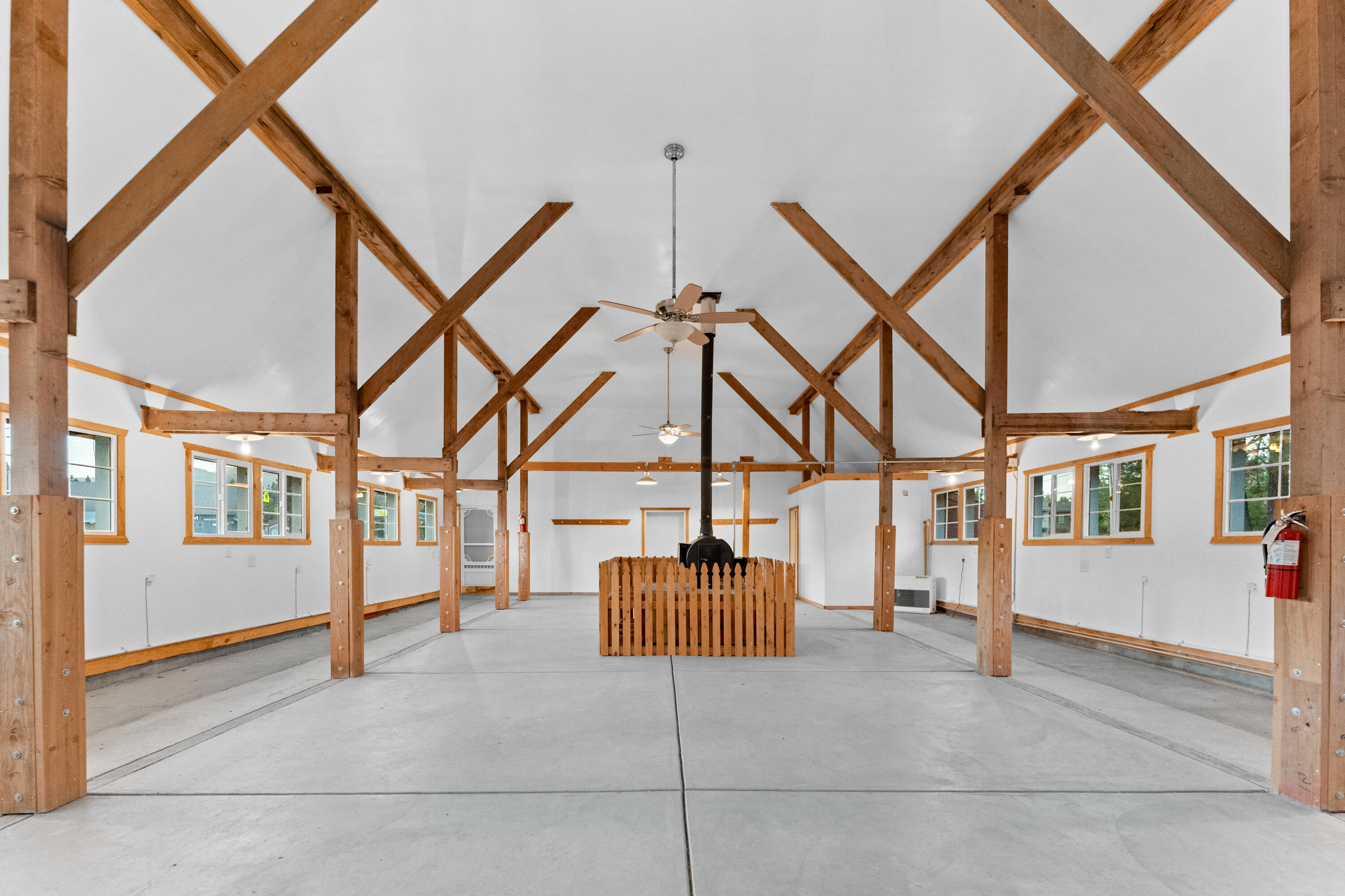 110 Squaw Valley Road McCloud, CA 96057 - Photo 4 of 20 a hallway with a couch and chandelier