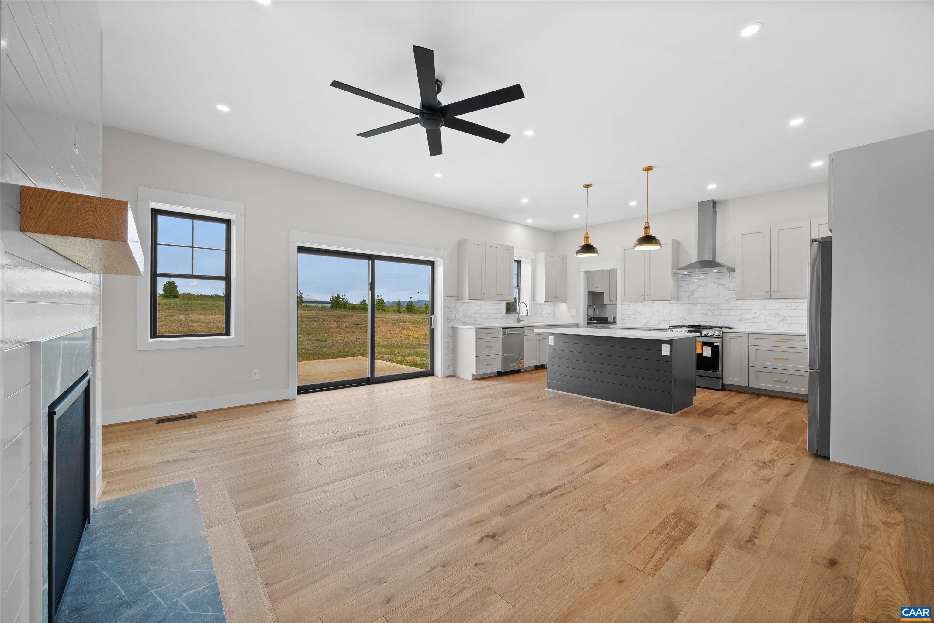 1416 Ladd Road Waynesboro, VA 22980 - Photo 11 of 66 a large room with stainless steel appliances kitchen island a sink dishwasher a refrigerator and a fireplace