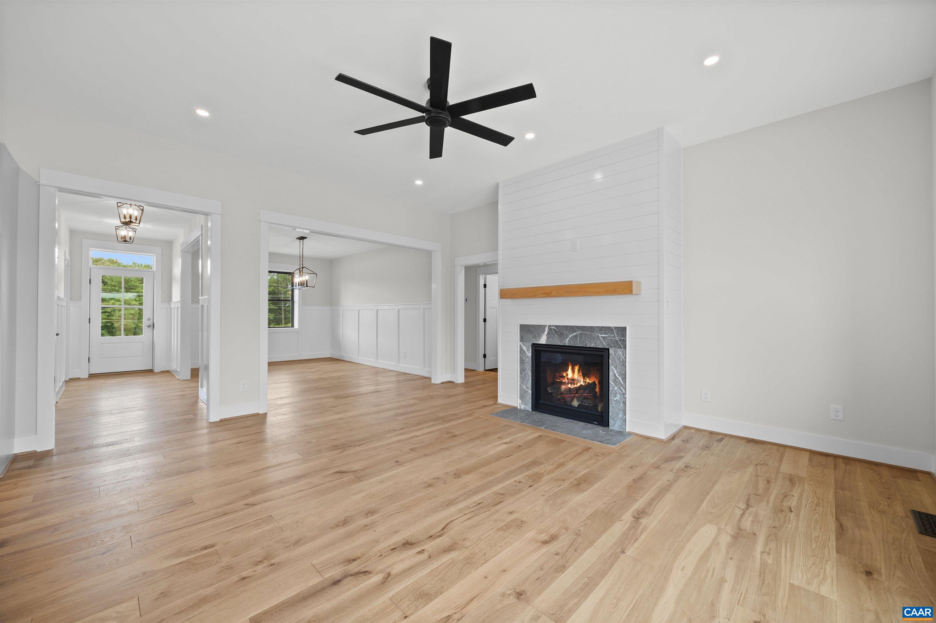 1416 Ladd Road Waynesboro, VA 22980 - Photo 14 of 66 a view of a livingroom with a fireplace a ceiling fan and windows