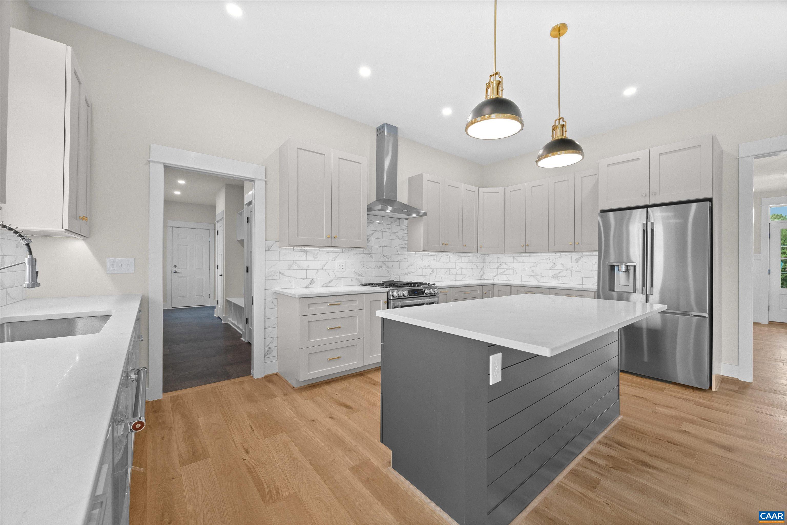 1416 Ladd Road Waynesboro, VA 22980 - Photo 16 of 66 a large kitchen with stainless steel appliances granite countertop a sink dishwasher a stove and a refrigerator with wooden floor