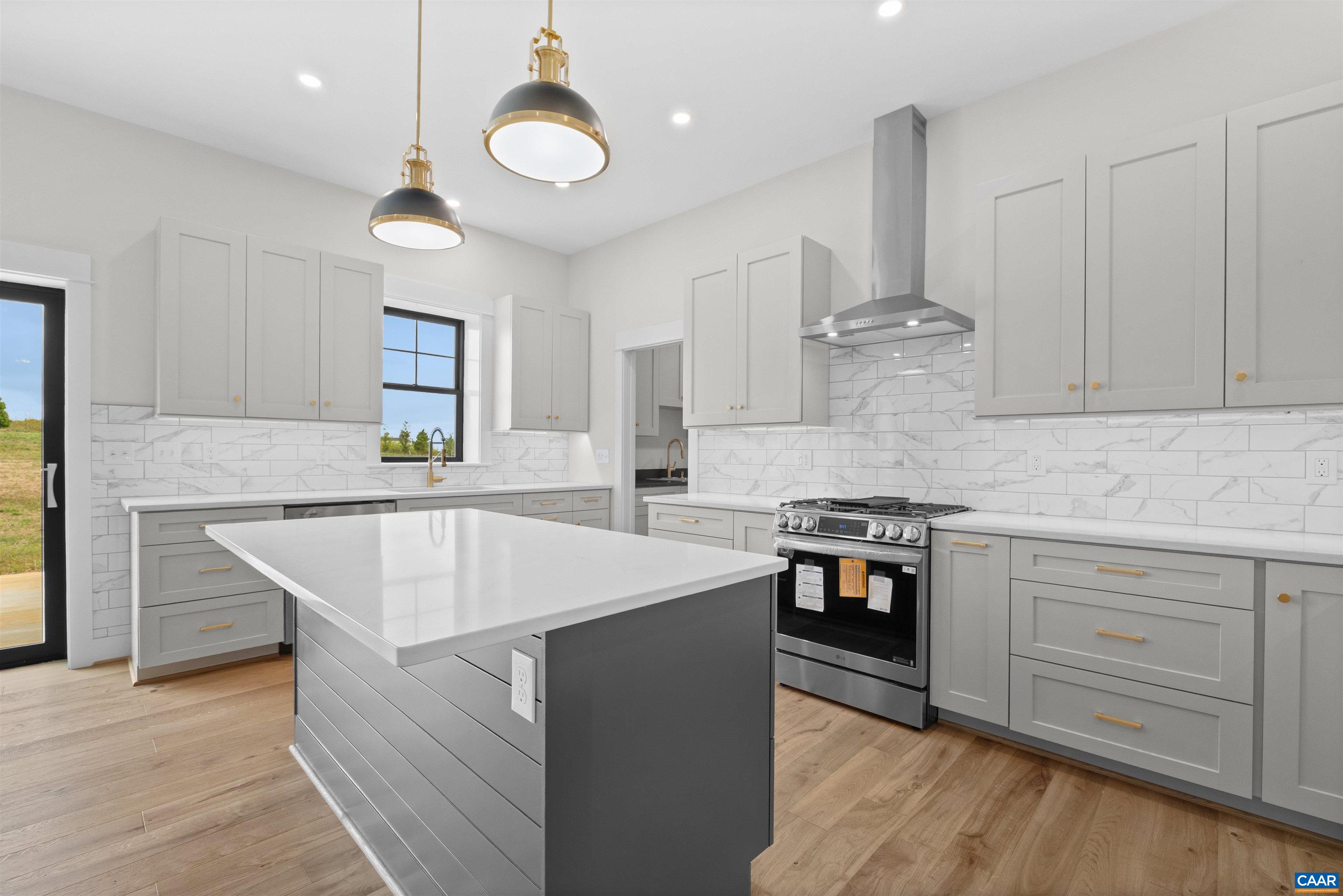 1416 Ladd Road Waynesboro, VA 22980 - Photo 18 of 66 a kitchen with stainless steel appliances granite countertop a sink a stove and a wooden floors