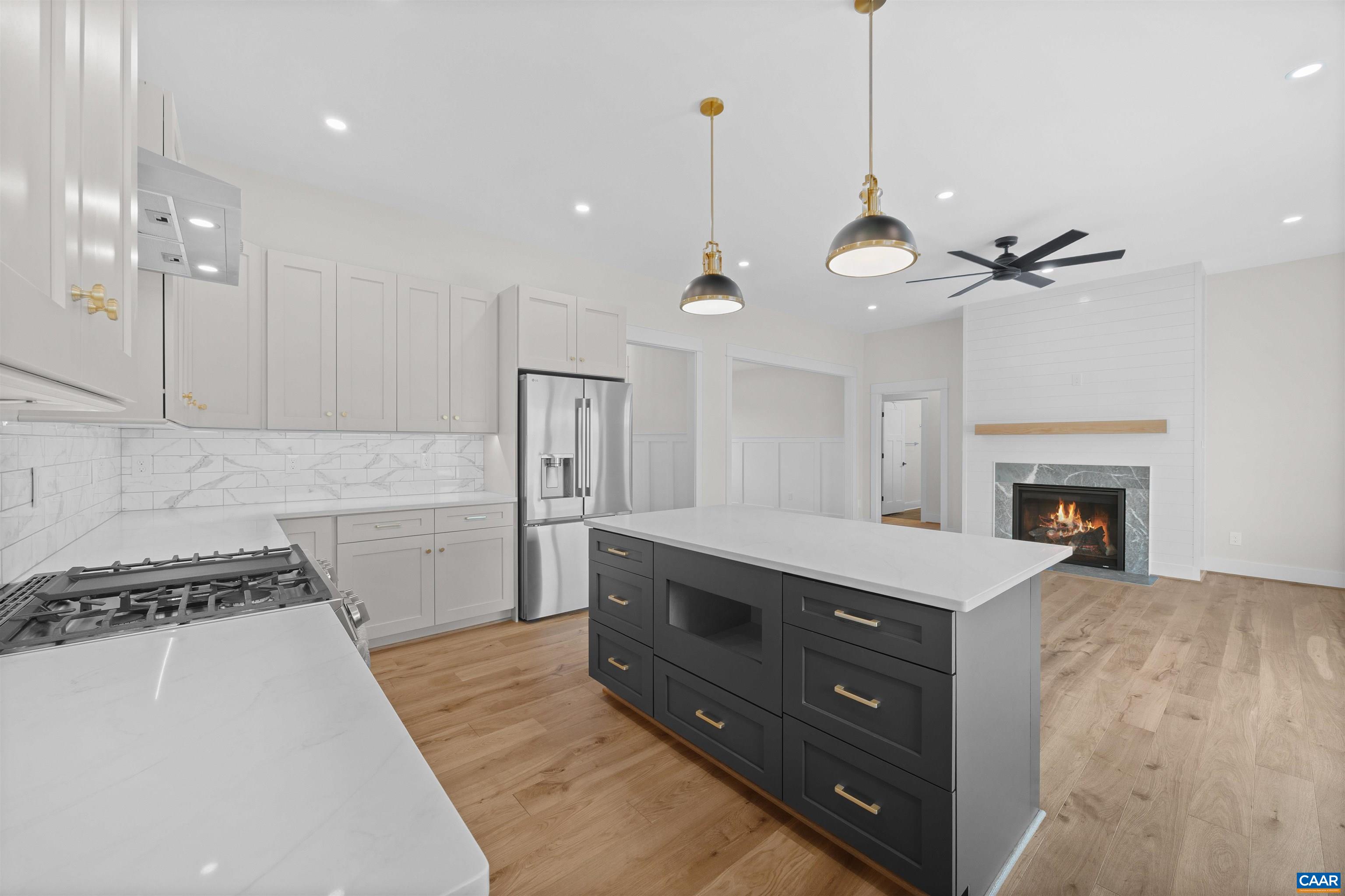 1416 Ladd Road Waynesboro, VA 22980 - Photo 21 of 66 a kitchen with a stove and a fireplace