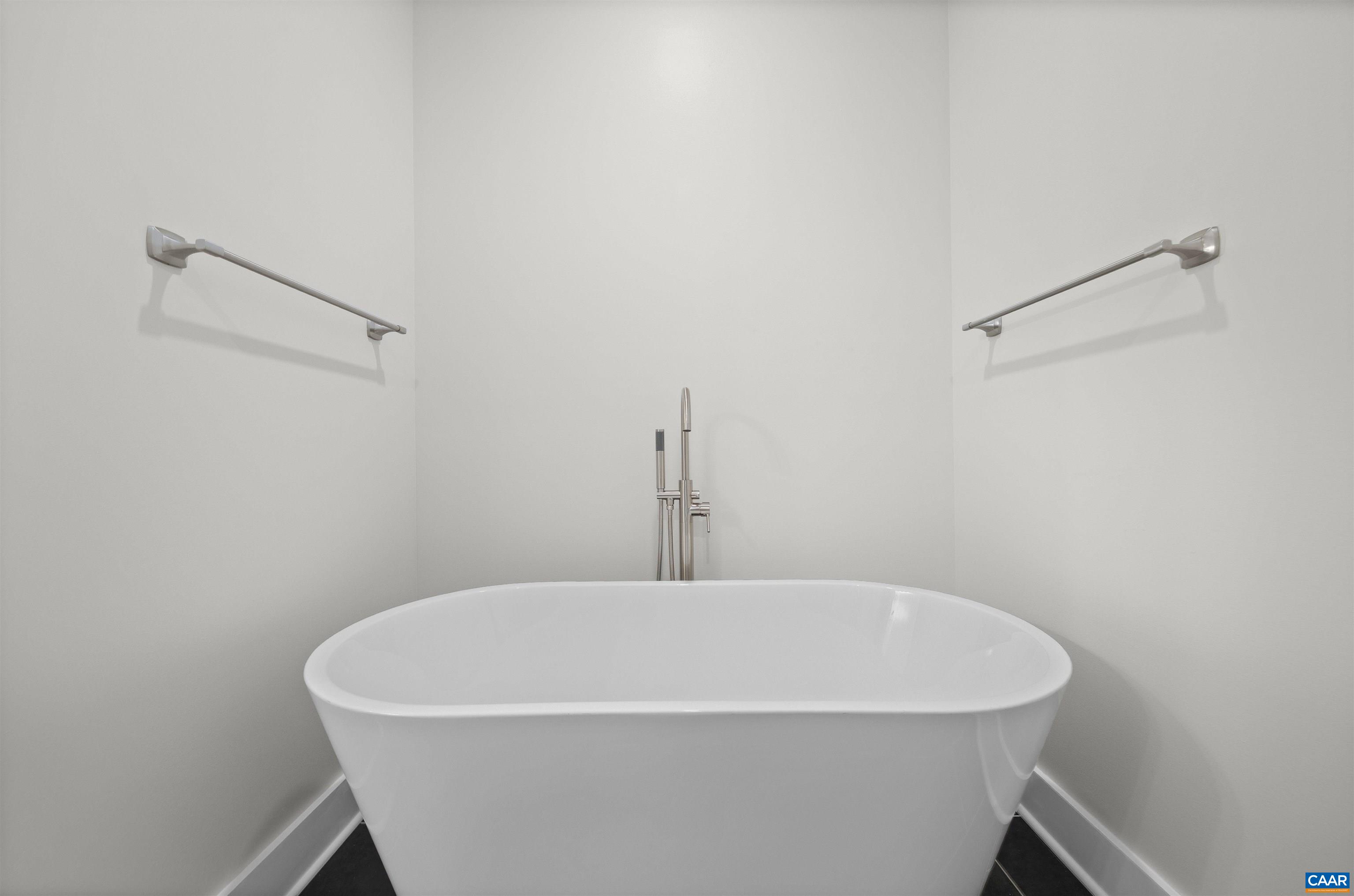 1416 Ladd Road Waynesboro, VA 22980 - Photo 28 of 66 a white bath tub sitting in a bathroom