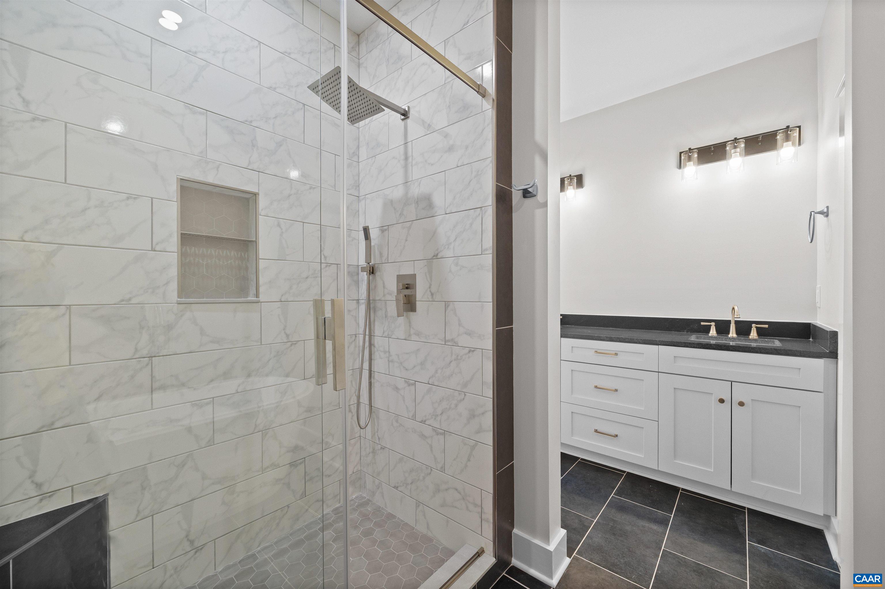 1416 Ladd Road Waynesboro, VA 22980 - Photo 29 of 66 a bathroom with a granite countertop sink a mirror and shower
