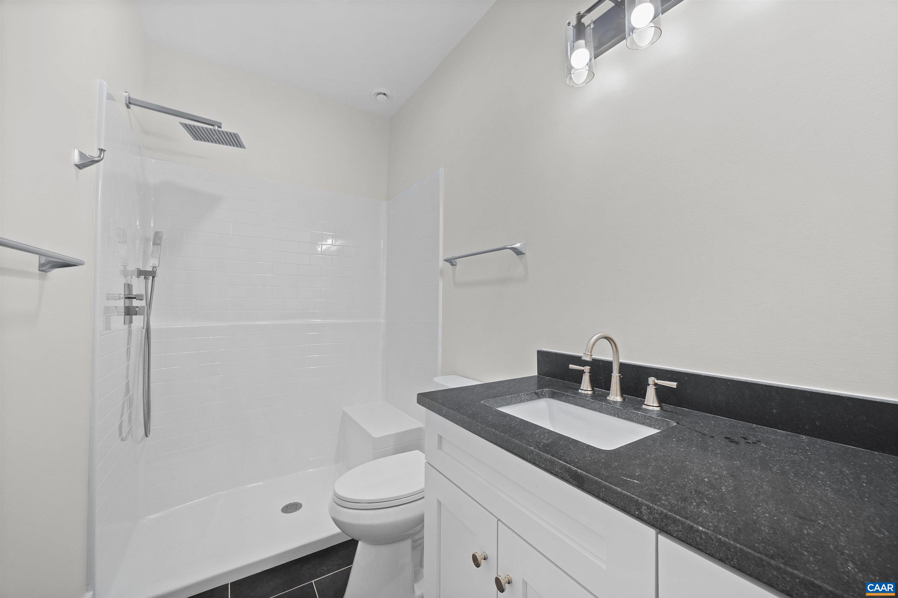 1416 Ladd Road Waynesboro, VA 22980 - Photo 33 of 66 a bathroom with a sink toilet and shower