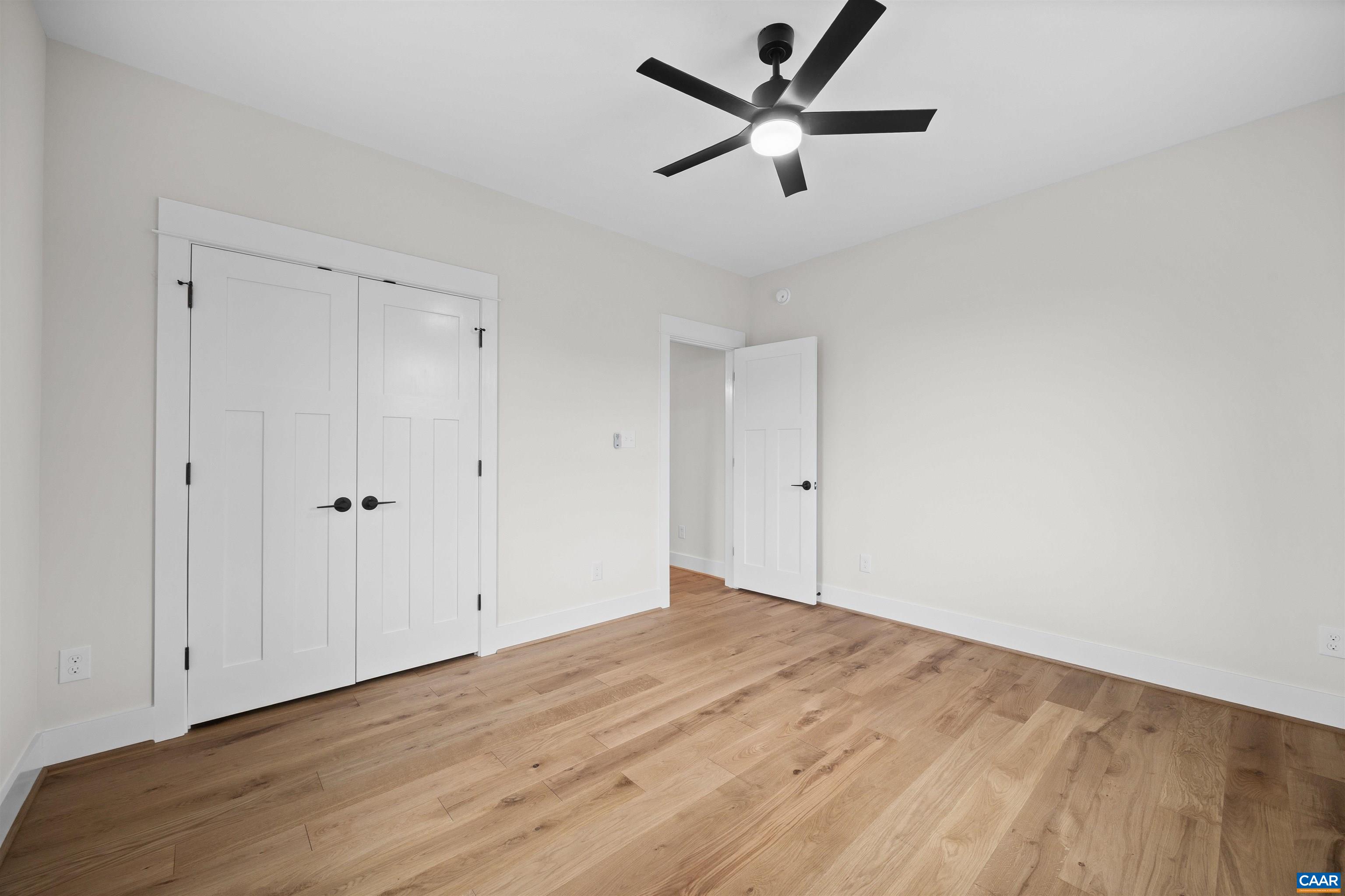 1416 Ladd Road Waynesboro, VA 22980 - Photo 35 of 66 an empty room with wooden floor and a ceiling fan