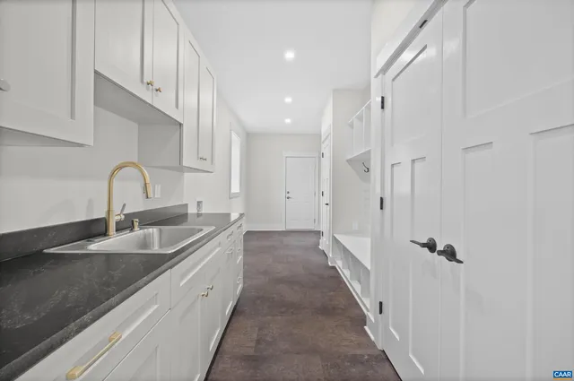 a view of a lake with a house in the background