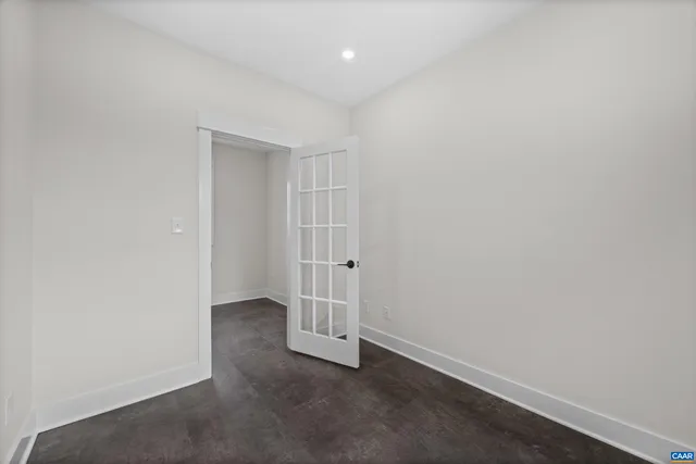 a front view of a house with a garden and yard