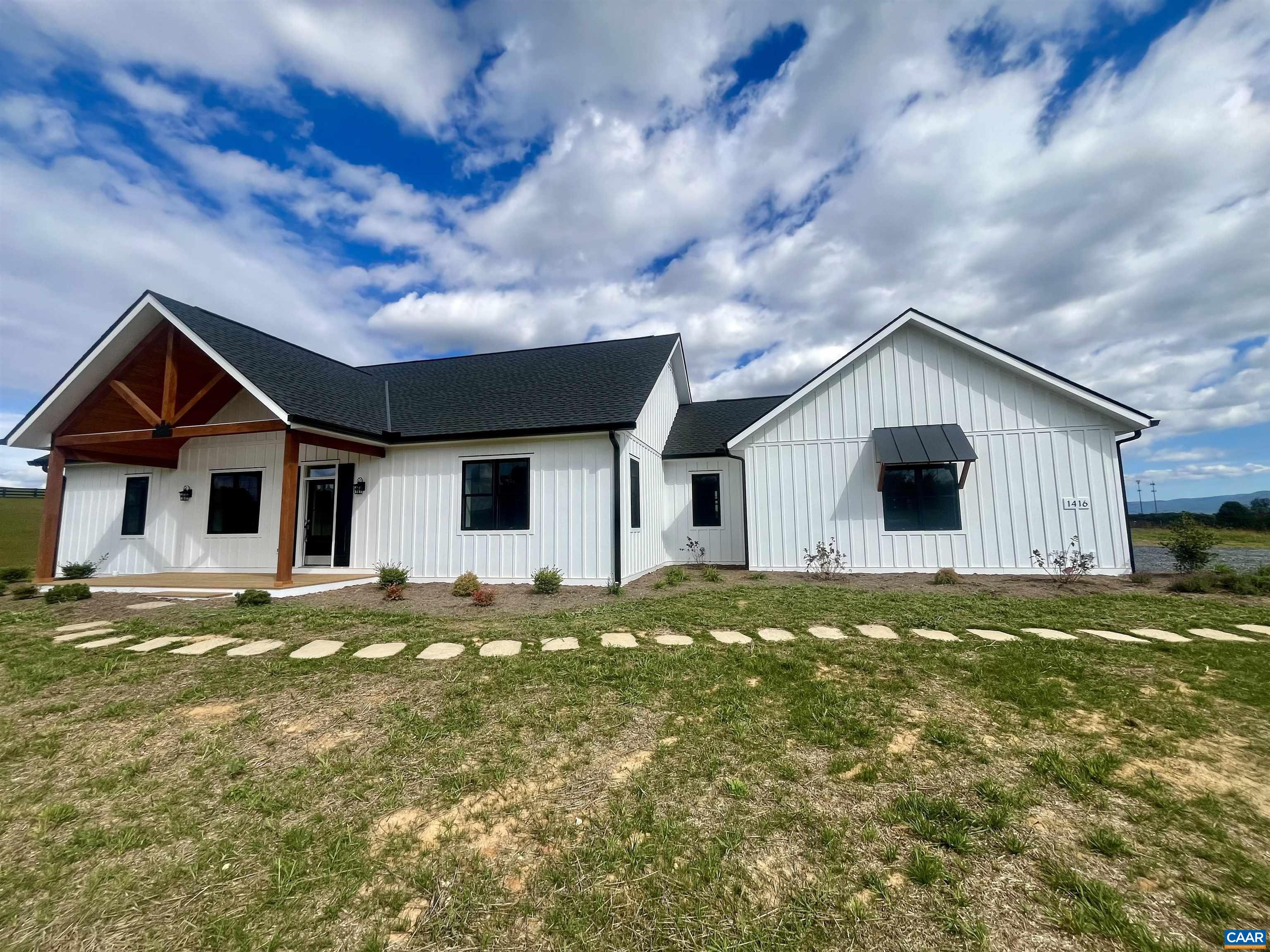 1416 Ladd Road Waynesboro, VA 22980 - Photo 51 of 66 a front view of a house with a garden and yard