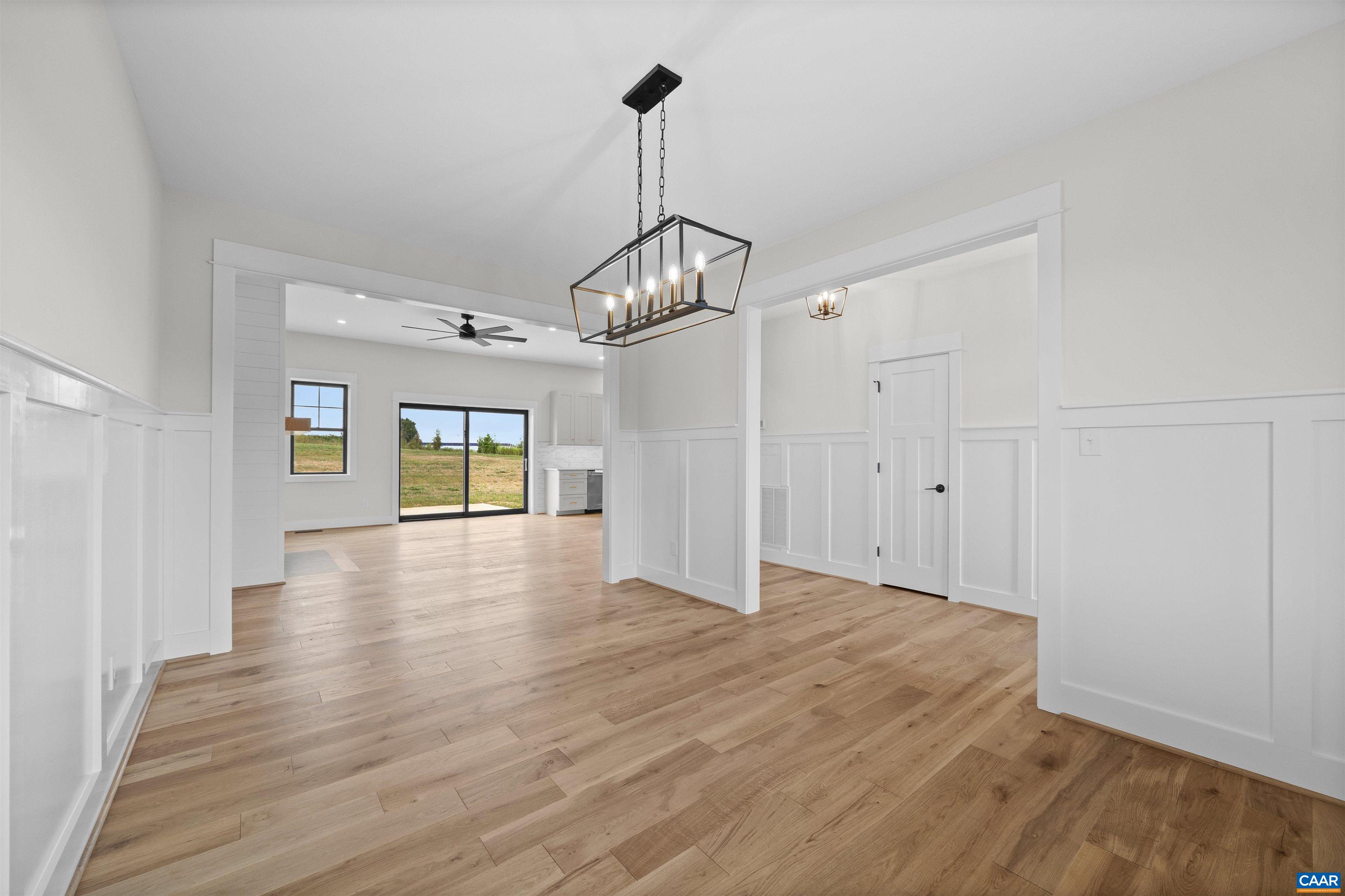 1416 Ladd Road Waynesboro, VA 22980 - Photo 10 of 66 a view of a room with wooden floor ceiling fan and windows
