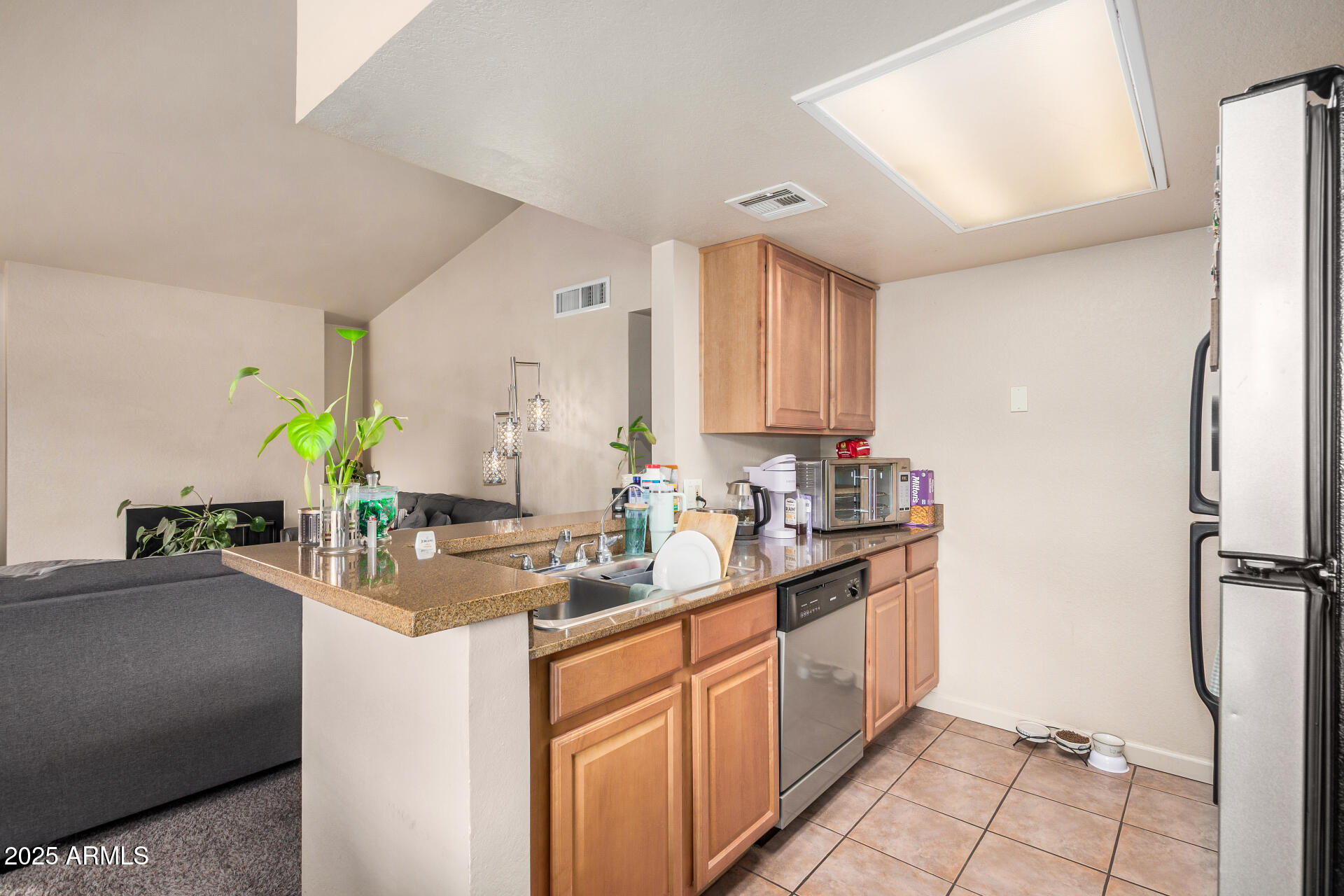 101 South Players Club Drive, Unit 22201 Tucson, AZ 85745 - Photo 13 of 31 a kitchen with sink cabinets and counter space
