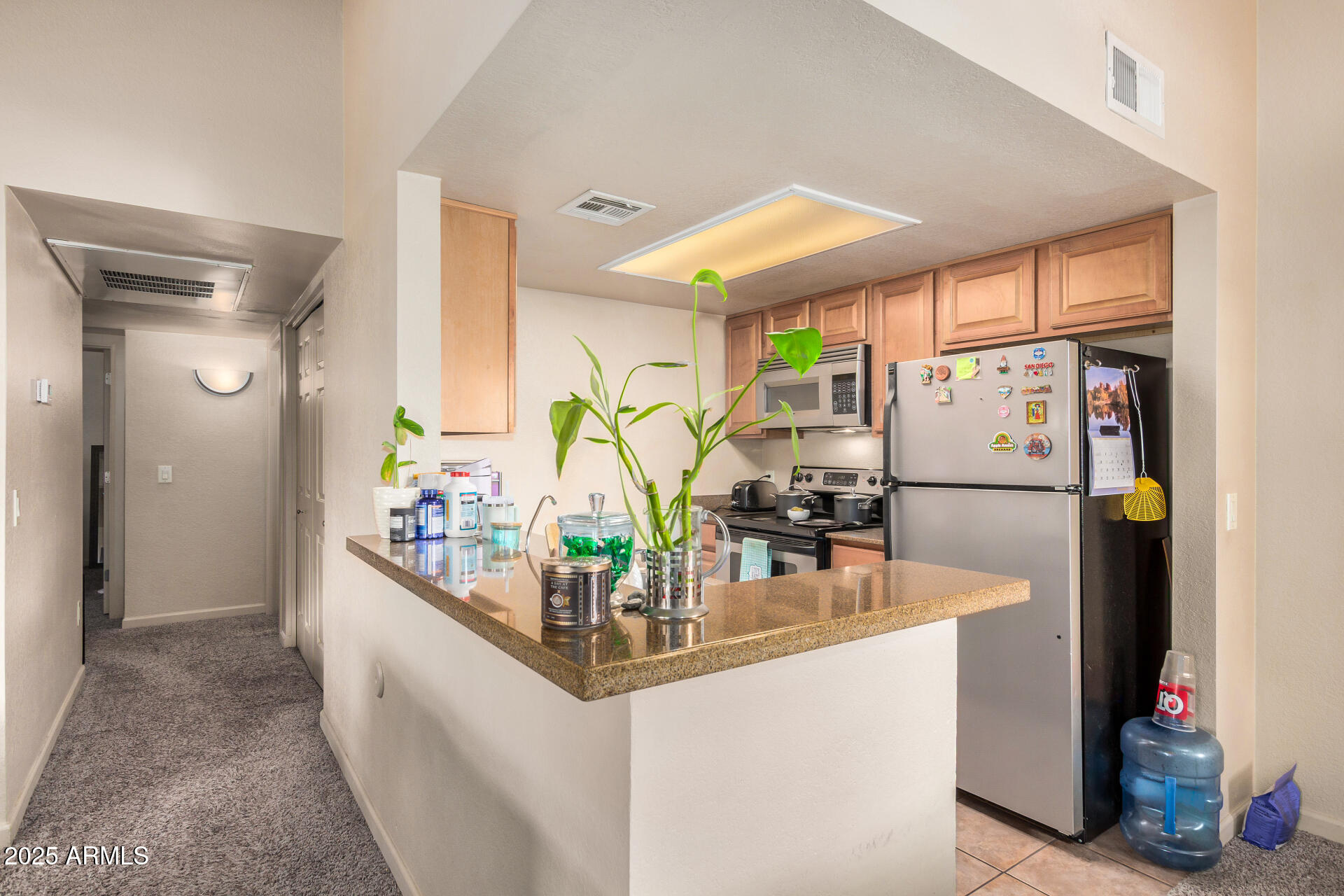 101 South Players Club Drive, Unit 22201 Tucson, AZ 85745 - Photo 15 of 31 a kitchen with sink and refrigerator