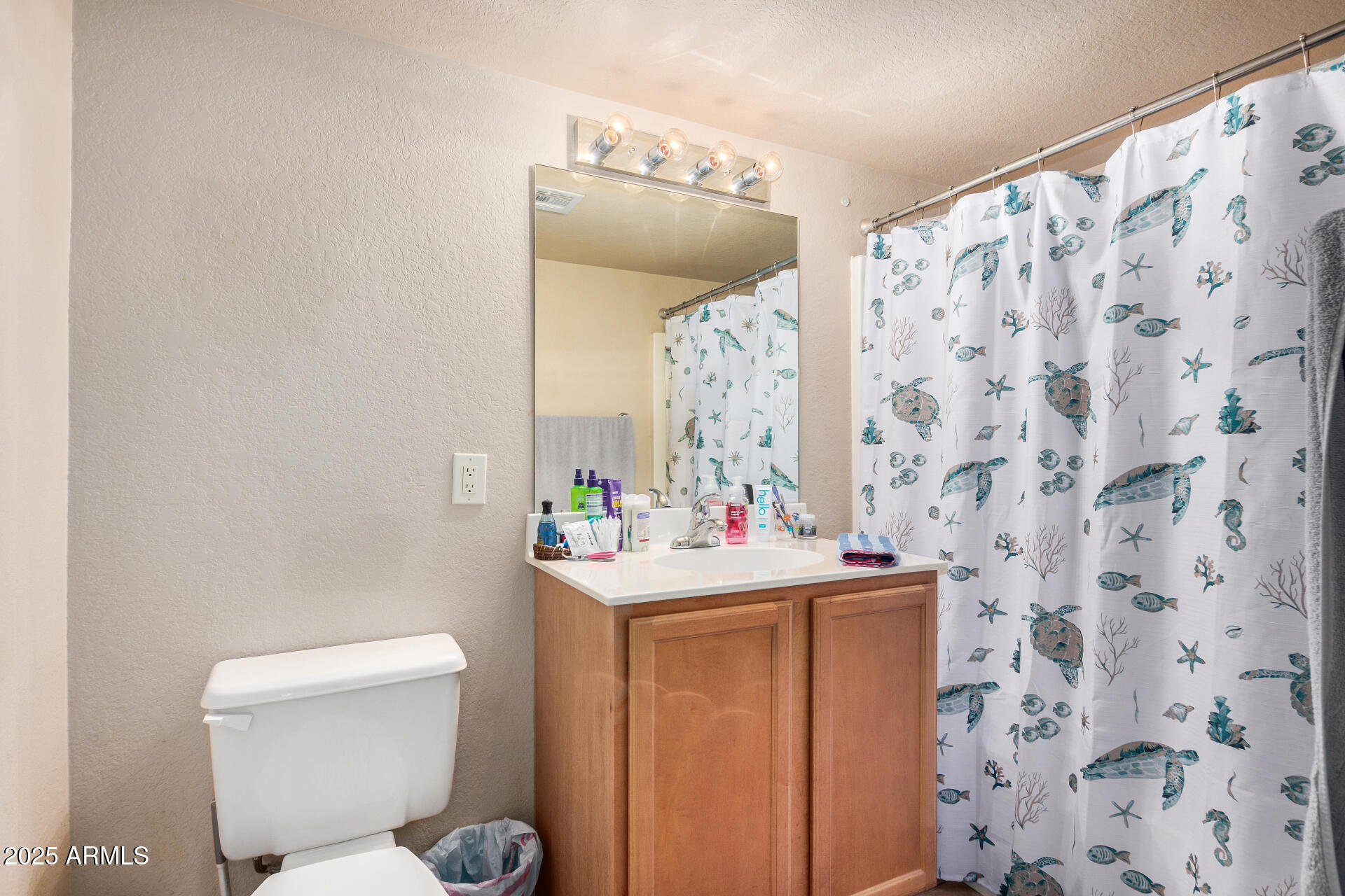 101 South Players Club Drive, Unit 22201 Tucson, AZ 85745 - Photo 20 of 31 a bathroom with a sink toilet and shower