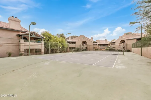 a view of a building with a yard