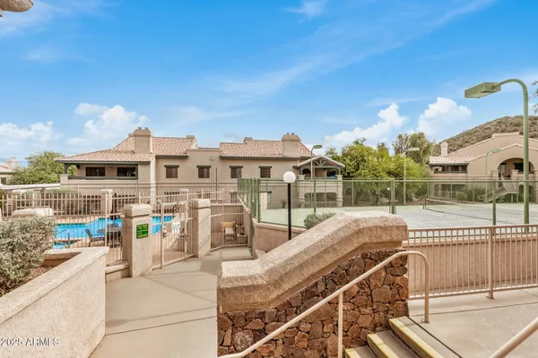 a view of a swimming pool with a patio