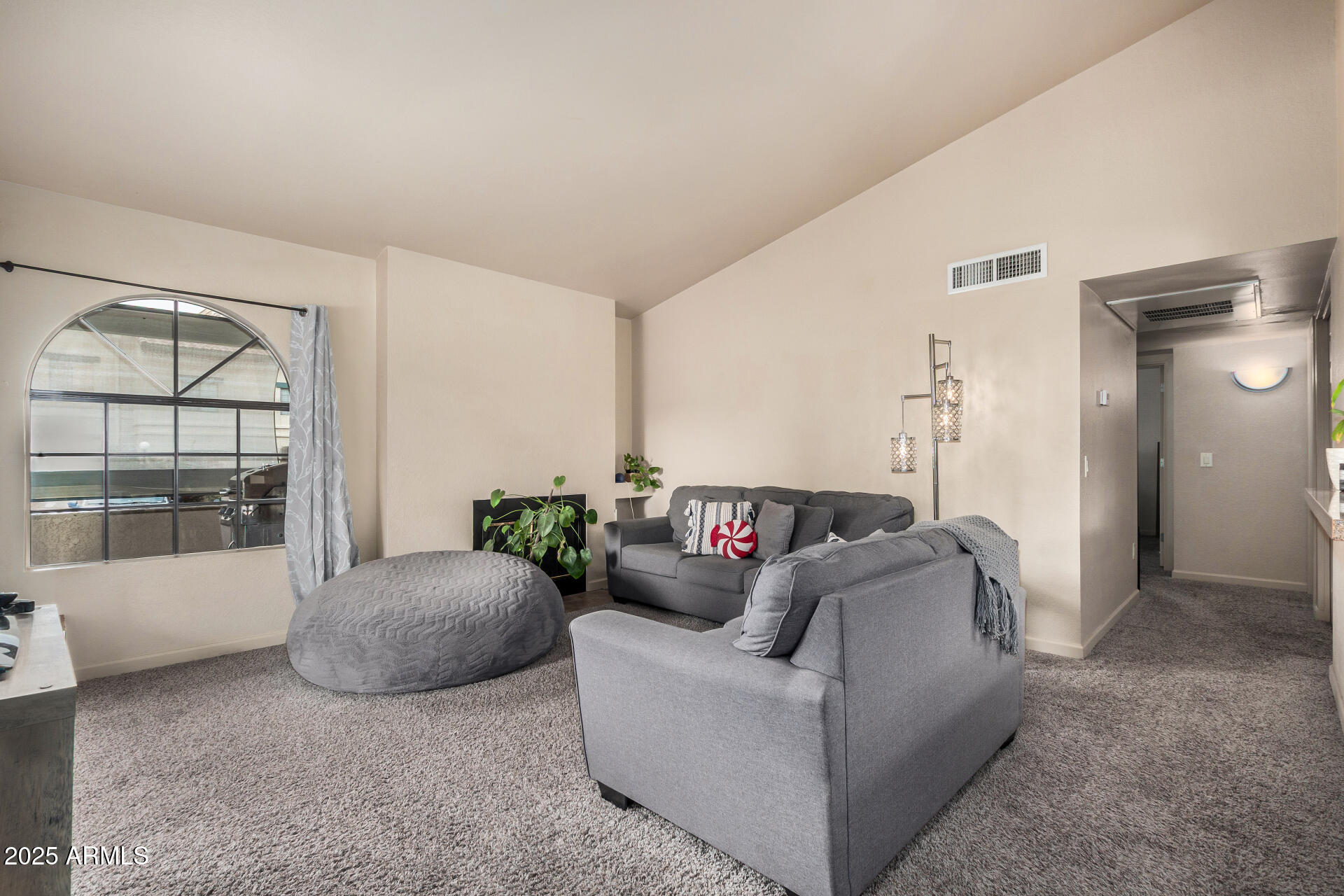 101 South Players Club Drive, Unit 22201 Tucson, AZ 85745 - Photo 7 of 31 a living room with furniture and a window