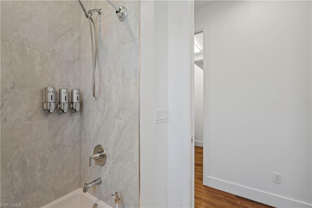 1100 Steeves Avenue Naples, FL 34104 - Photo 17 of 38 a bathroom with a shower