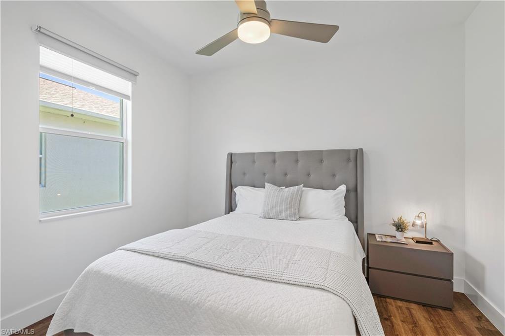 1100 Steeves Avenue Naples, FL 34104 - Photo 19 of 38 a bedroom with a bed and a window